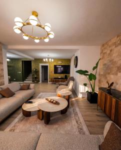 a living room with a couch and a table at Luxury Villa Bar in Bar
