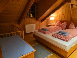 a bedroom with two beds in a attic at BUAMA Kammer in Abtenau +48 photos