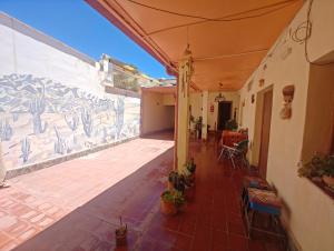 a house with a painting on the side of a wall at Inti Sayana in Humahuaca