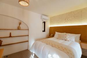 a bedroom with a white bed in a room at Bernardino Boutique Hotel in Guanajuato