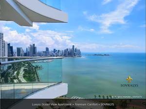 a view of the city from the balcony of a building at 80M Luxury Ocean View Apartment PH The Sands, Next to Hilton in Panama City