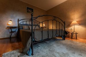 a bedroom with a metal bed in a room at Villa Boljuncica in Boljun