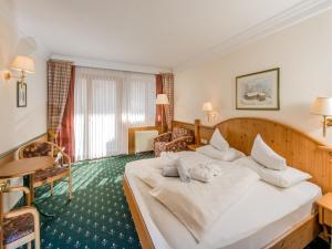 A bed or beds in a room at Vital - und Wellnesshotel Hanneshof