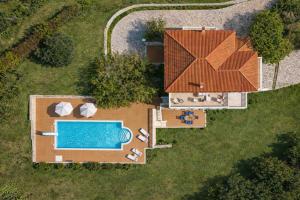 an overhead view of a house with a swimming pool at Villa Aether Methoni in Methoni