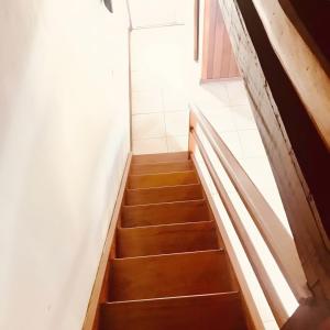 a staircase in a room with a stair case at Pousada Pinho Verde in Monte Verde