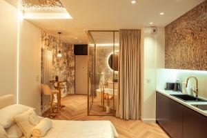 a bathroom with a shower and a bed and a sink at Gdańsk Luxury Stay Jacuzzi in Gdańsk
