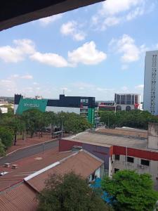 a view of a city with buildings and a street at Ada 507 avenida pioneros del este in Ciudad del Este