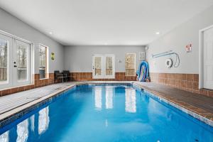 a swimming pool with blue water in a house at Apalachee Pool lodge in Cosby