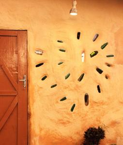 a wall with a painting of a face on a wall at BioChalé Buena Vista in Sao Jorge +9 photos