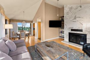 a living room with a couch and a fireplace at Best Western PLUS Inner Harbour Hotel in Victoria