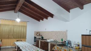 a kitchen with a table in the middle of it at Casa vacanze San Gianni in Ardore Marina