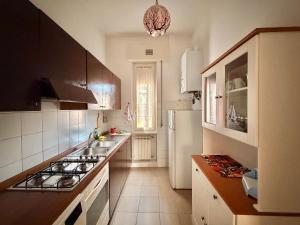a kitchen with a sink and a stove top oven at Santo Spirito in Arezzo
