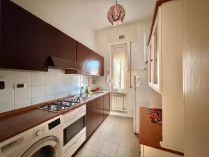 a kitchen with a stove top oven next to a refrigerator at Santo Spirito in Arezzo +78 photos