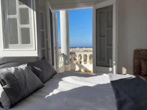 a bedroom with a bed with a view of the ocean at Duplex Villa 4 rooms in Marsa Matruh +116 photos
