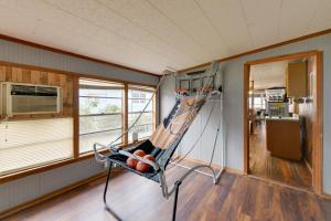 a room with a hammock in the corner of a room at Lake Views + Dock Access: Georgetown Group Getaway in Georgetown