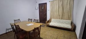 a living room with a table and a couch at El limonero in Paso de los Libres +1 photo