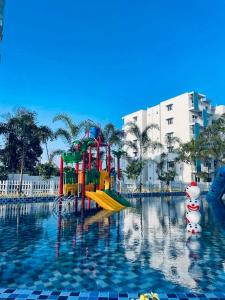 a water park with a playground in the water at Santorini Transit hotel in Negombo +14 photos