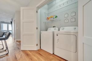 a white laundry room with a washer and dryer at Stillwater 113 in Arnolds Park