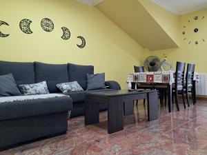 a living room with a couch and a table at Ultreia in Arcade