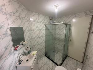 a bathroom with a shower and a toilet and a sink at Casa Beira Mar lha de Itamaracá in Itamaracá +12 photos