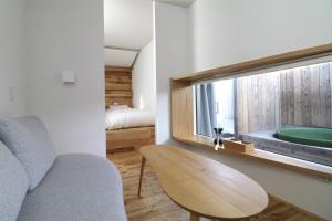 a room with a chair and a window and a bed at BLANC FUJI in Fujiyoshida +97 photos