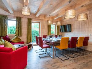 a dining room with a table and chairs at Adventure Lodge Kaprun in Kaprun