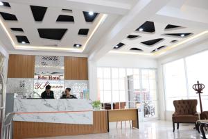 a lobby of a restaurant with a reception counter at Edu HOTEL Y-SKANAM SYARIAH in Surabaya