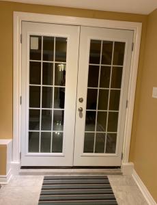 a door with french doors in a room at Peaceful escape in Ottawa