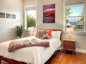 a bedroom with a bed with two towels on it at Mountain View Adventures in Heber City