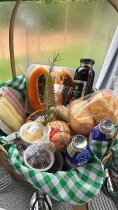 a basket filled with different types of bread at Chalés Colina dos Colibris in Santa Teresa