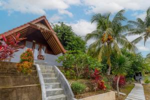 a house with stairs leading up to it at La Rise Penida Cottage in Nusa Penida +17 photos