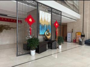 a lobby with red decorations in a building at Happy Hours in Shenzhen