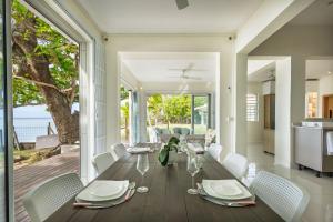 a dining room with a table and chairs at Amarea Beach Front Appartment or Studio in Richeterre