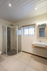 a bathroom with a shower and a sink at Amarea Beach Front Appartment or Studio in Richeterre +58 photos