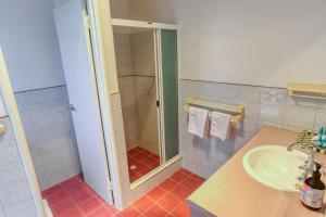 a bathroom with a shower and a sink at Ibis Rest Beach House in Geographe +23 photos