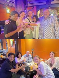 a group of people standing and sitting around a table at Lakeside Inn in Guilin +12 photos