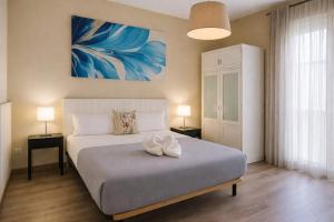 a bedroom with a bed with a white bow on it at AYZ Villegas - Auto check-in property in Madrid