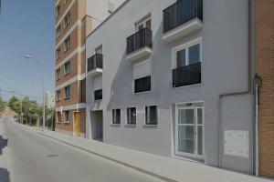 an empty street in front of a building at AYZ Villegas - Auto check-in property in Madrid