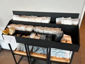 a display case filled with different types of food at The358 UMI in Fukuoka