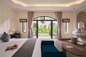a bedroom with a bed and a large window at Narci Resort Tam Coc in Ninh Binh +105 photos