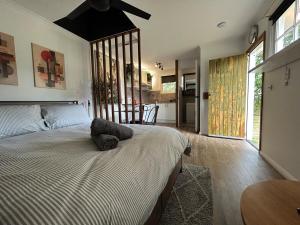a bedroom with a bed with a pillow on it at Guest House in East Devonport in Devonport