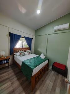 a bedroom with a bed and a window at Villa Tucano in Fortuna