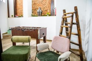 a room with two chairs and a table and a ladder at Casa Dana, Losar de la Vera in Losar de la Vera +25 photos