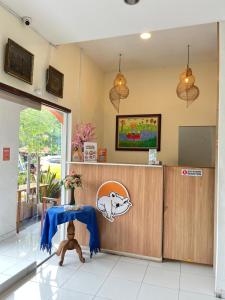 a room with a counter with a table in it at The Cabin Tugu Hostel in Yogyakarta