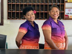 two women standing next to each other at Hotel Takia in Labasa