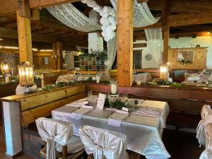 a dining room with a table and chairs at Hochberghaus Resort in Grünau im Almtal