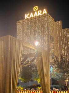 a large building with a sign on top of it at Kaara Gurgaon in Gurgaon