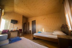 Postel nebo postele na pokoji v ubytování Hotel Nikala