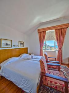 Postel nebo postele na pokoji v ubytování Hotel Monte Carlo