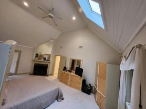 a bedroom with a bed and a skylight at Eagles Nest Mansion in Montgomery